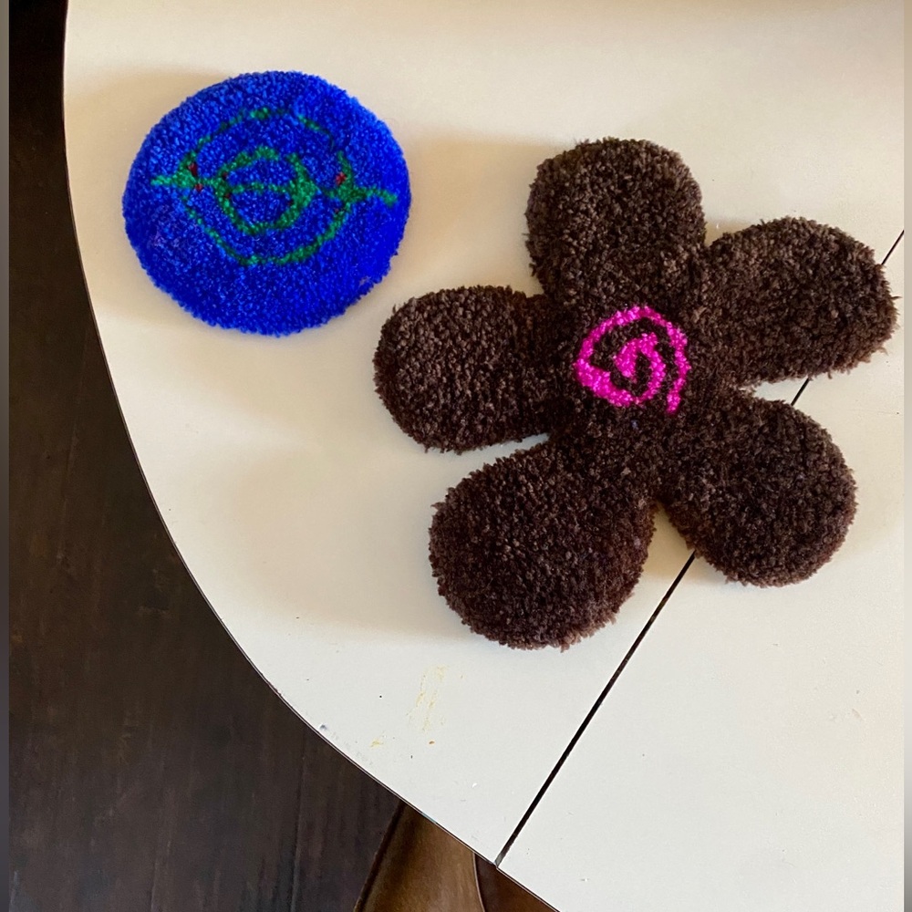 Two coasters made of rug fabric